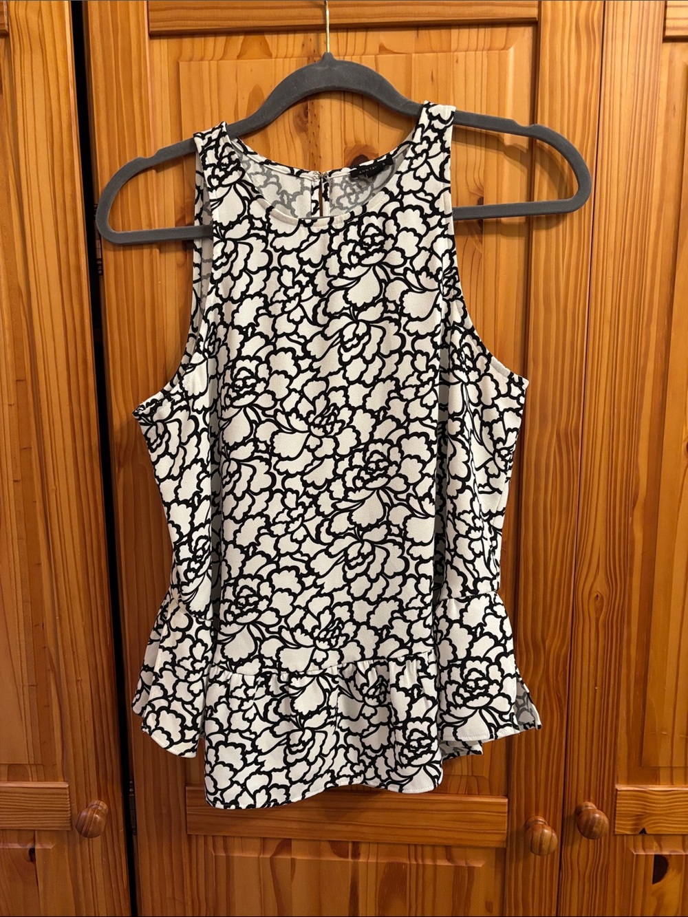 Ann Taylor Black and White Floral Peplum Tank! Stylish and machine washable!